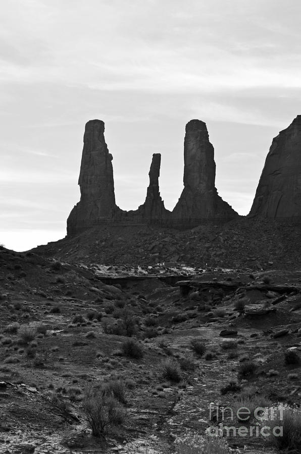 Monument Valley Three Sisters Sandstone Spire Formation Black and White Photograph by Shawn OBrien