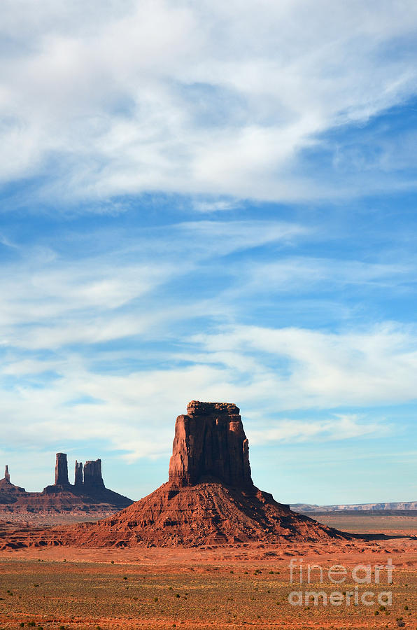 Monument Valley Utah Red Sandstone Monoliths Rising Up Above Desert Floor Vertical Photograph by Shawn OBrien