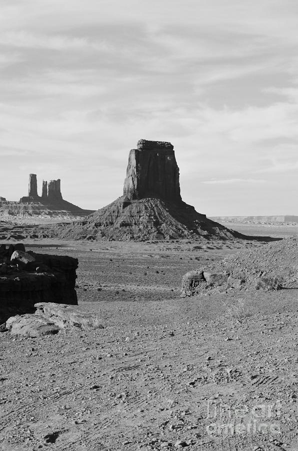 Monument Valley Utah Sanstone Butte Rising Up Above Desert Plain Black and White Photograph by Shawn OBrien