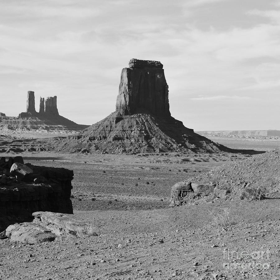 Monument Valley Utah Sanstone Butte Rising Up Above Desert Plain Square Format Black and White Photograph by Shawn OBrien