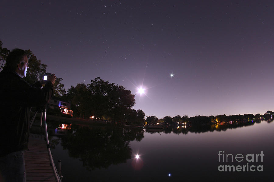 Moon And Jupiter Over Lake Photograph by John Chumack