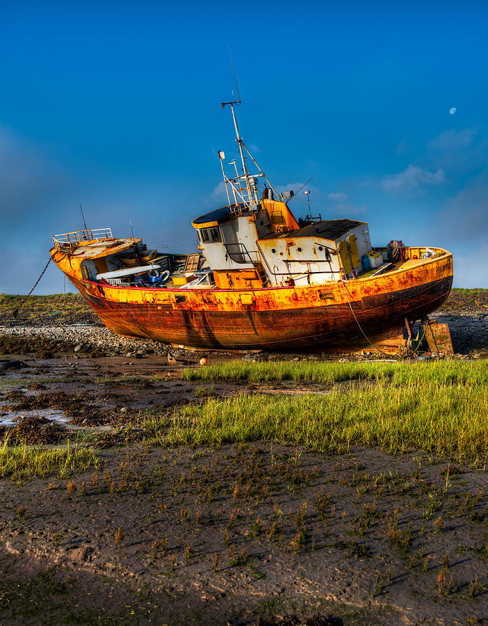 Moon over Beached Fishing Boat in Rampside UK Photograph by Dennis Dame