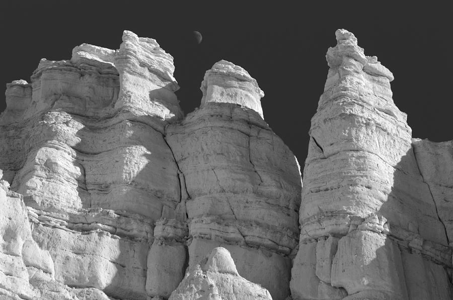 Moon over rocks Photograph by Carolyn DAlessandro