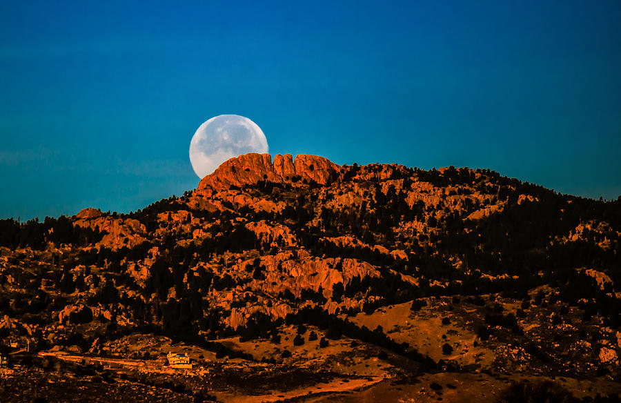 Moon Setting Behind Horsetooth Rock at Sunrise Photograph by Harry Strharsky