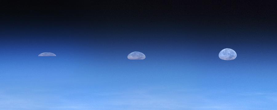 Space Photograph - Moonrise over Earth, ISS image by Science Photo Library