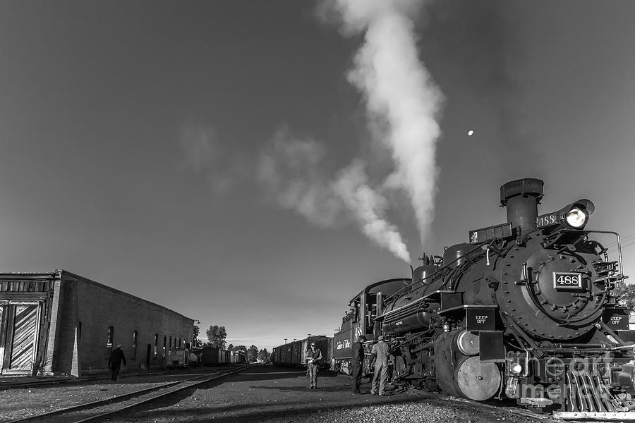 Distant Moon At Train Yard Photograph by Robert Frederick