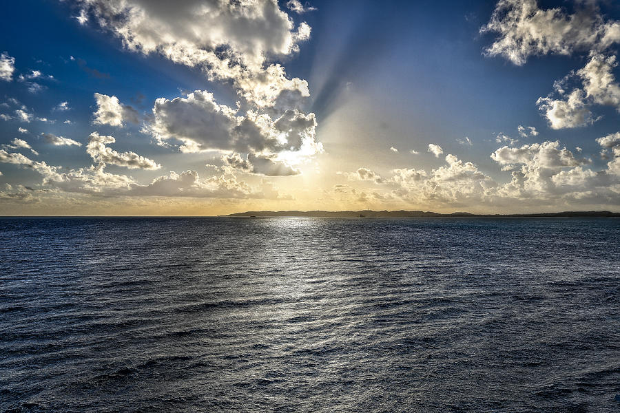 Morning sun punching through the clouds in St. Croix Photograph by Craig Bowman