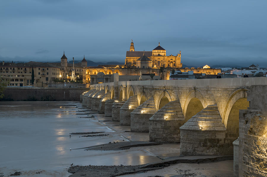 City Photograph - Mosque Cathedral of Cordoba also called the Mezquita and Roman Bridge by Ayhan Altun