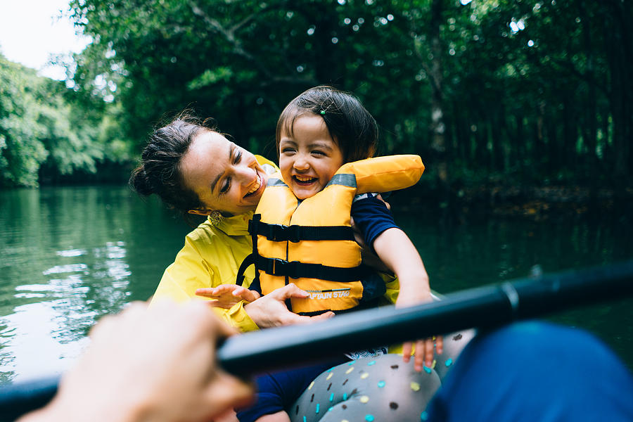 Mother and child having fun with mangrove river kayaking Photograph by Ippei Naoi