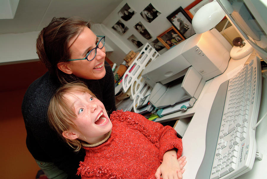 Mother And Daughter At A Home Computer Photograph by Cc Studio/science Photo Library