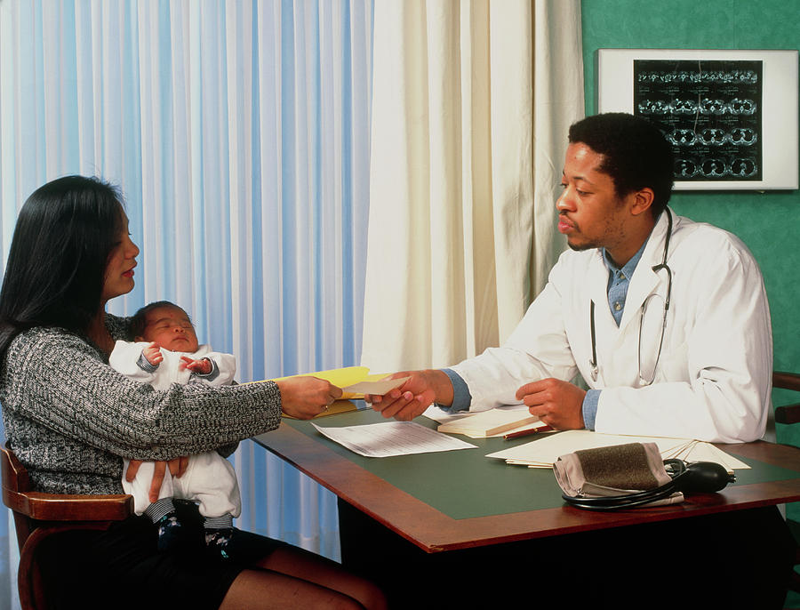 Mother And Her Baby Visiting A Gp Doctor Photograph By Cc Studio ...