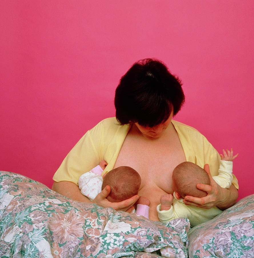 Mother Breast-feeding Her Twins At The Same Time Photograph by Alex Bartel/science Photo Library