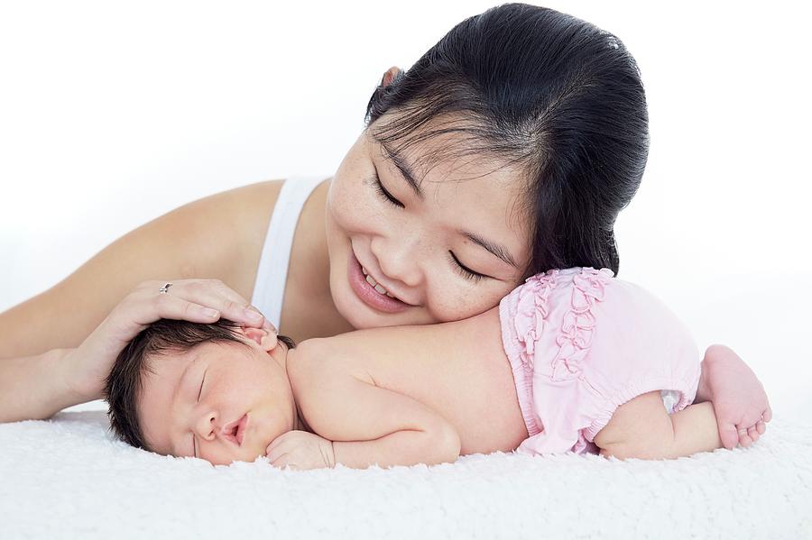 Mother Stroking Newborn Baby Girls Head Photograph by Ruth Jenkinson/science Photo Library