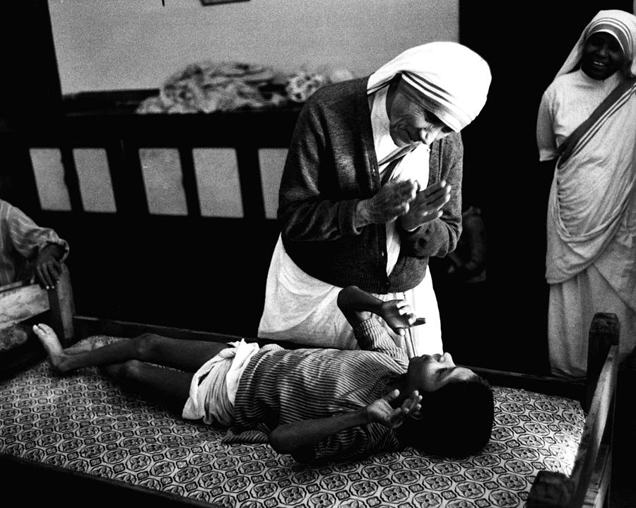 Mother Teresa Helping Boy Photograph by Retro Images Archive
