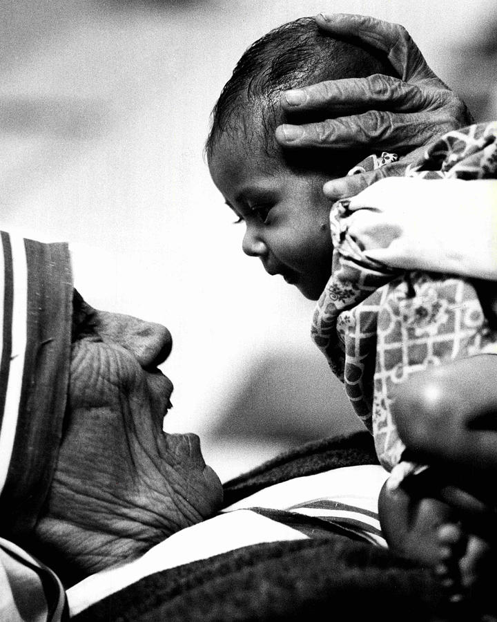Classic Photograph - Mother Teresa Holds Baby by Retro Images Archive