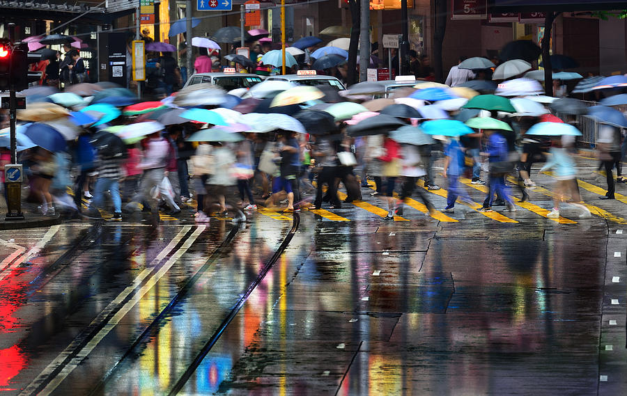 Motion blurred pedestrians crossing Hong Kong street in the rain Photograph by Olaser