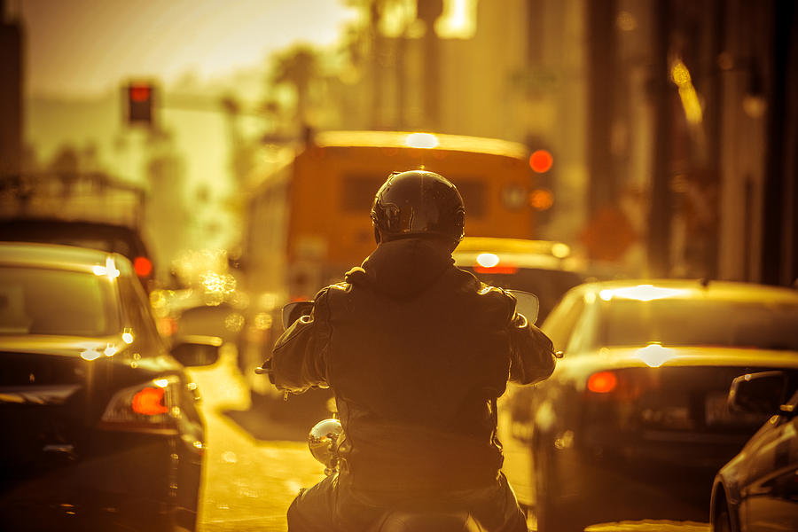 Motorcyclist in Traffic jam Photograph by Anouchka