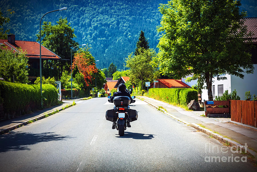 Motorcyclist touring along Austria Photograph by Anna Om