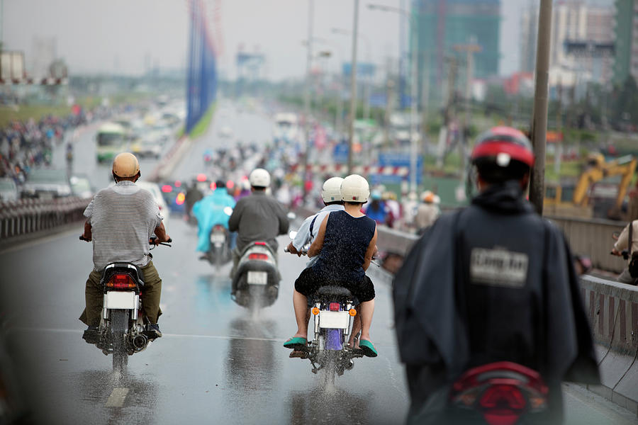 Motorcyclists On Road In Rain, Ho Chi Photograph by Eternity In An Instant