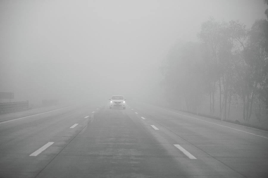 Motorway Driving In Fog Photograph by Sindre Ellingsen