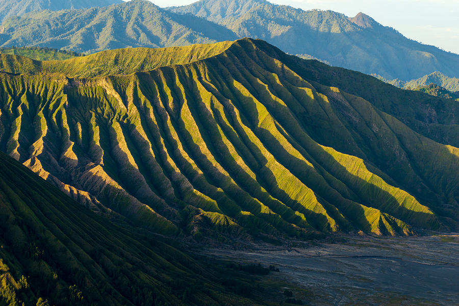 Mount Batok (2,470m), though lying adjacent to Mount Bromo. With a perfect triangular mountain top, rising from a sea of volcanic ash surrounding the Mount Bromo caldera. East Java of Indonesia. Photograph by Shaifulzamri