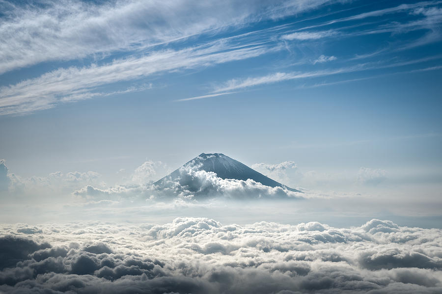 Mount Fuji rising above the clouds Photograph by Extreme-photographer