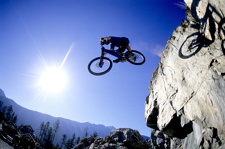 Mountain Biker Making A Jump Photograph by Scott Markewitz - Pixels