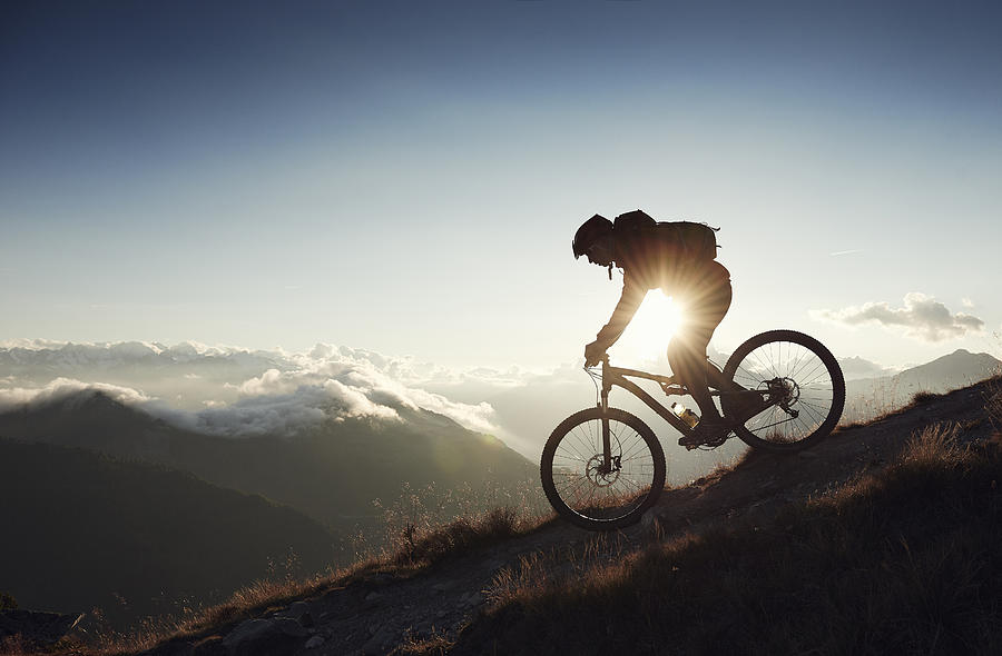 Mountain biker riding downhill, Valais, Switzerland Photograph by Jakob Helbig