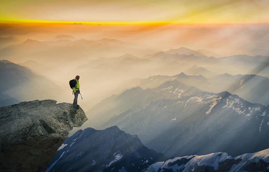 Mountain climber standing on edge of mountain, looking at view, Courmayeur, Aosta Valley, Italy, Europe Photograph by Lost Horizon Images
