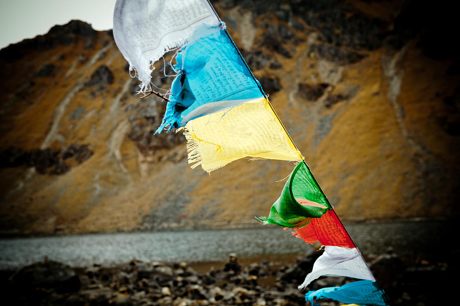 Nature Photograph - Mountain lake GOSAIKUNDA Flags Lungta by Raimond Klavins