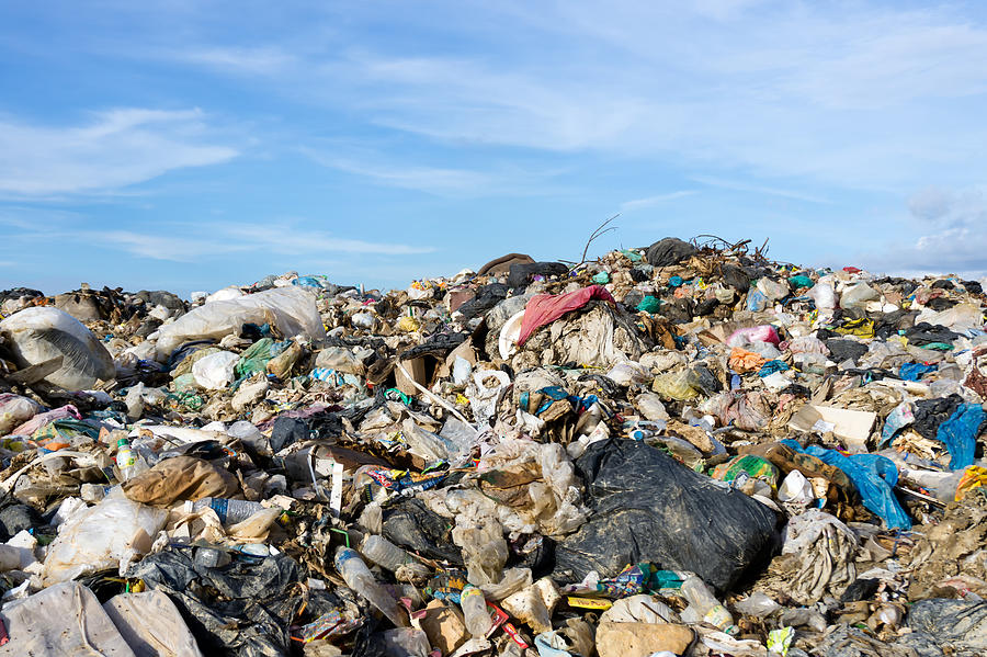 Mountain of garbage at the landfill site with blue sky Photograph by Nora Carol Photography