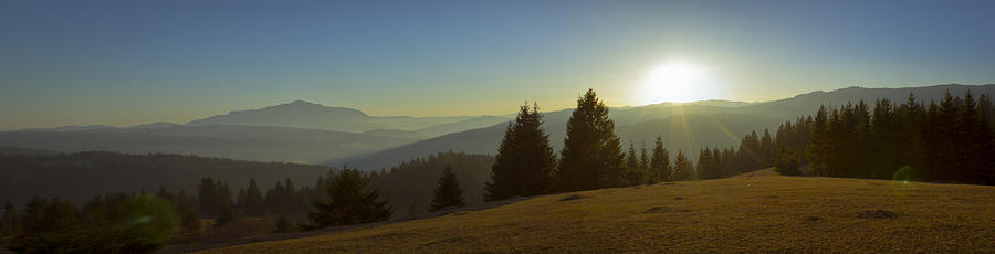 Mountain panorama at sunset with beautiful sun glare Photograph by Vlad Baciu