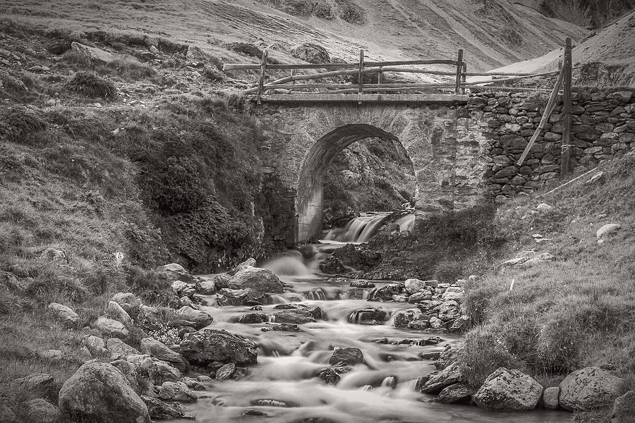 Mountain stream with bridge Photograph by Roberto Pagani