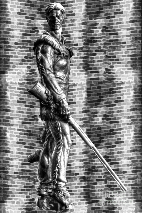 Mountaineer statue with black and white brick background Photograph by Dan Friend