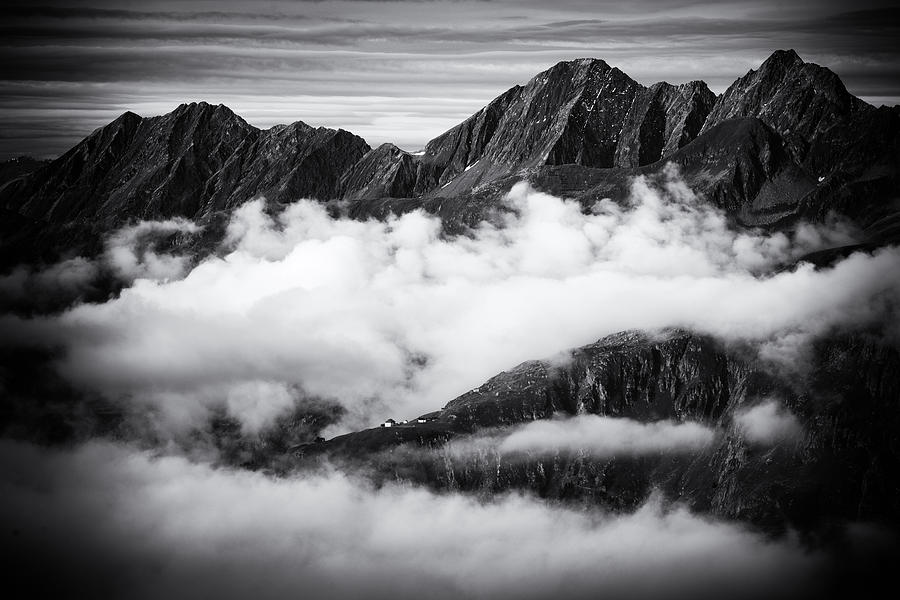 Mountains and clouds black and white Photograph by Matthias Hauser