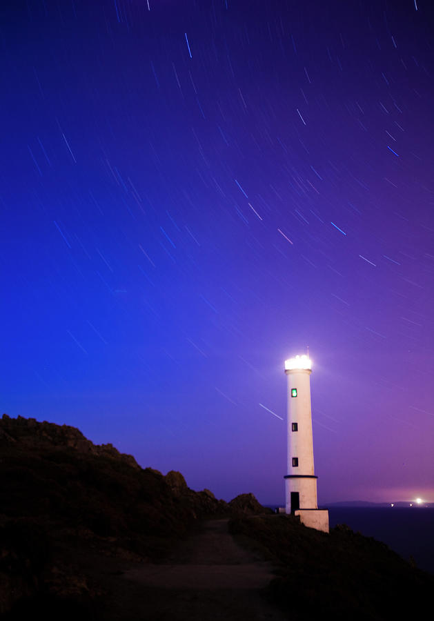 Moving Stars Around Lighthouse Photograph by Enrique Díaz / 7cero