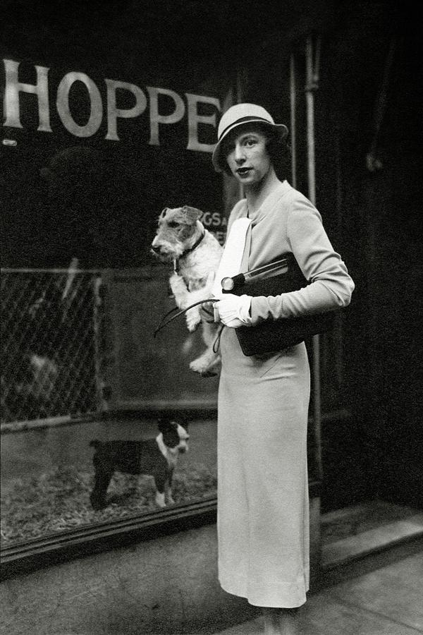 Mrs. Geoffrey Mcn. Gates Holding A Dog Photograph by Cecil Beaton