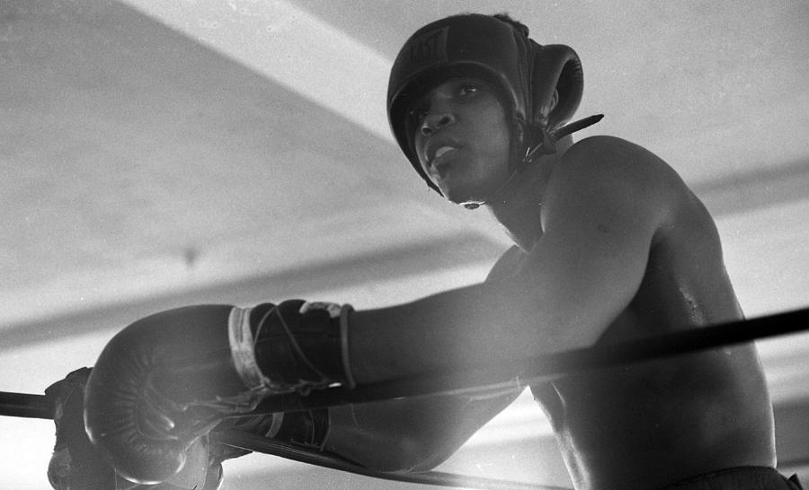 Vintage Photograph - Muhammad Ali Gloves Resting On Ropes by Retro Images Archive