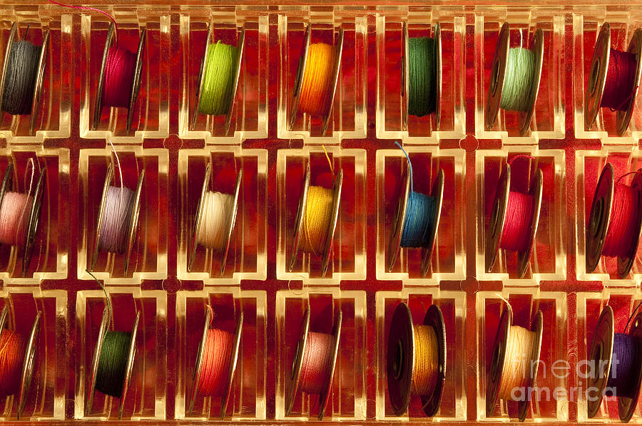 Mulitcolored tray of metal sewing thread spools Photograph by Jim Corwin