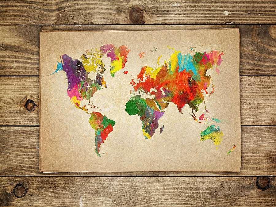 Multi-colored continents on a paper world map Photograph by Sorendls