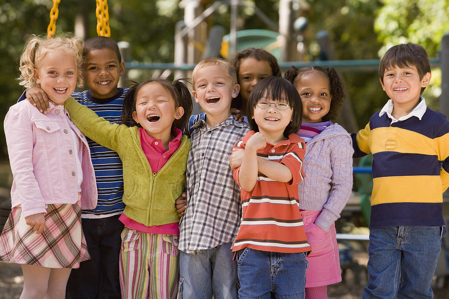 Multi-ethnic children at playground Photograph by Ariel Skelley