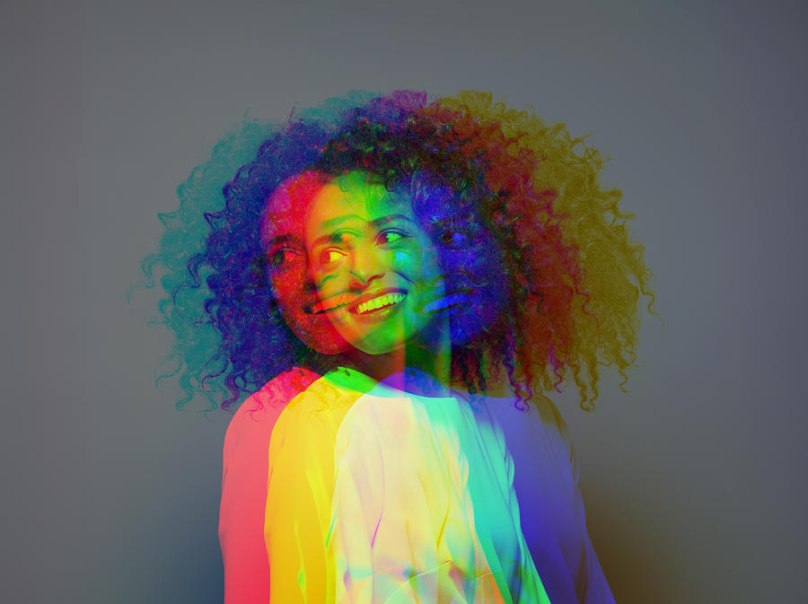 Multiple exposure,dark skinned female smiling Photograph by Jonathan Knowles