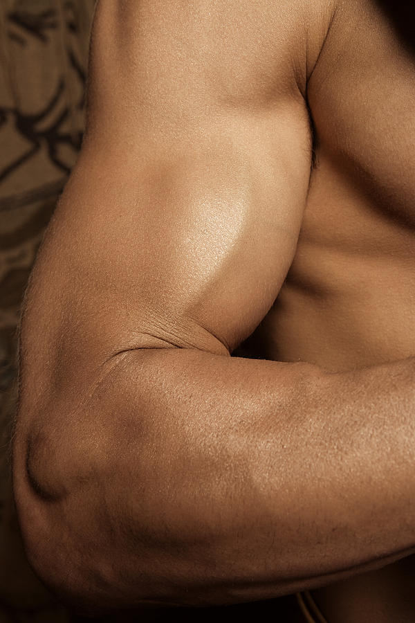 Muscular arm Photograph by Image Source