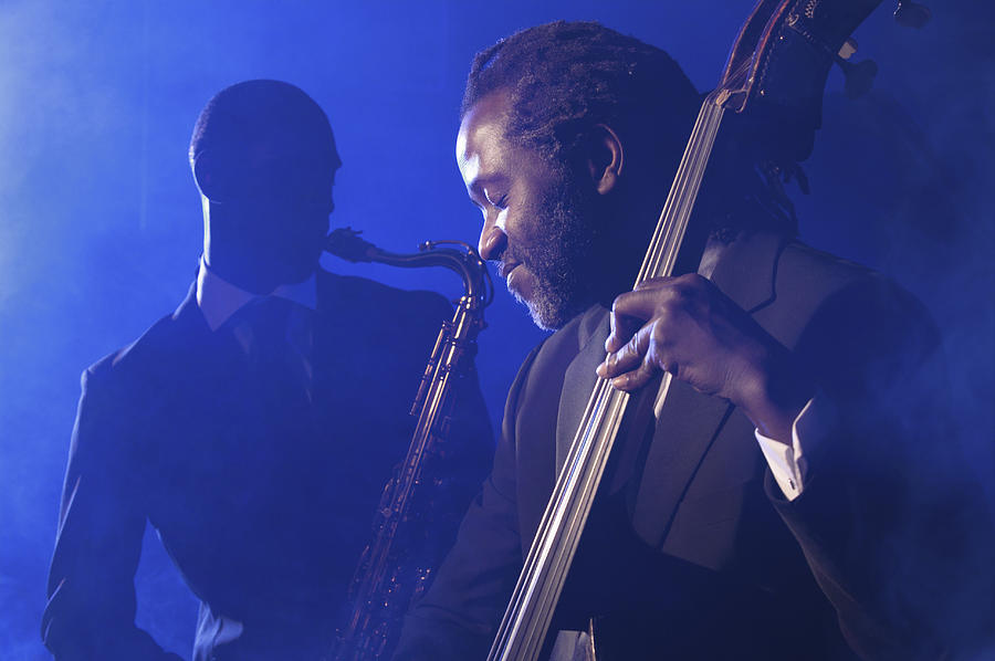 Musician Playing the Double Bass in Front of a Man Playing an Alto Saxophone Photograph by Nick White