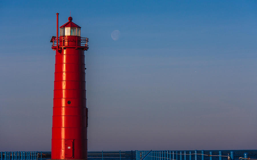 Muskegon Lighthouse in March with Moonset Photograph by Joe Holley