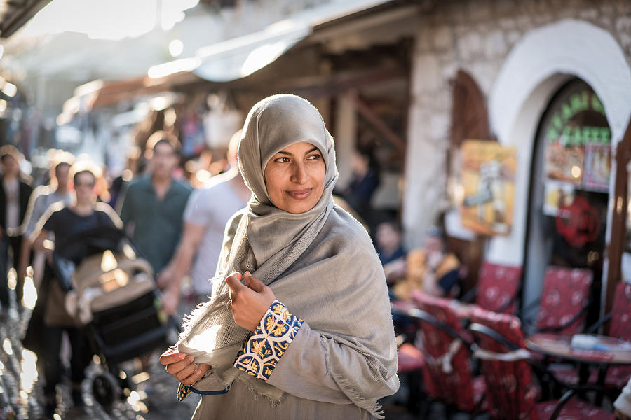 Muslim woman on street Photograph by Jasmin Merdan