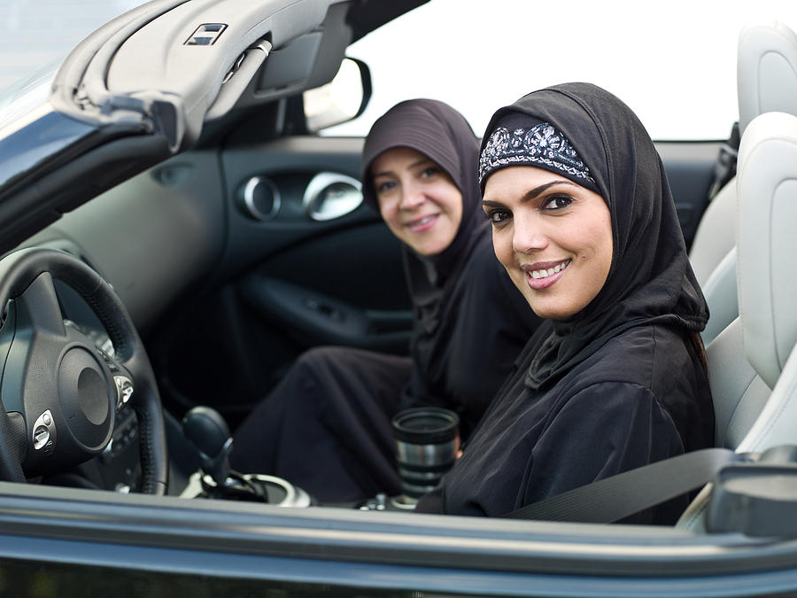 Muslim women in a convertible Photograph by Juanmonino