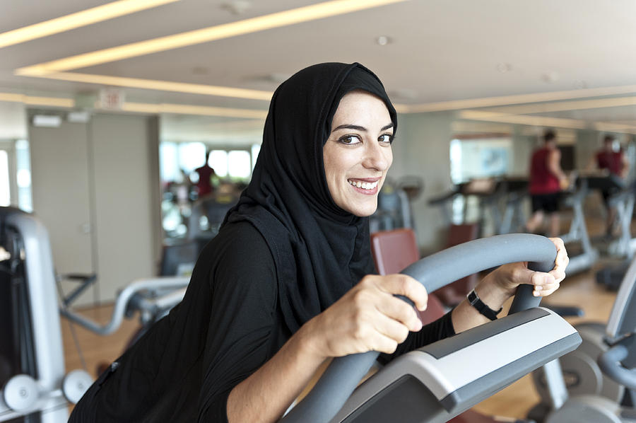 Muslim Young Woman Exercising Photograph by Juanmonino