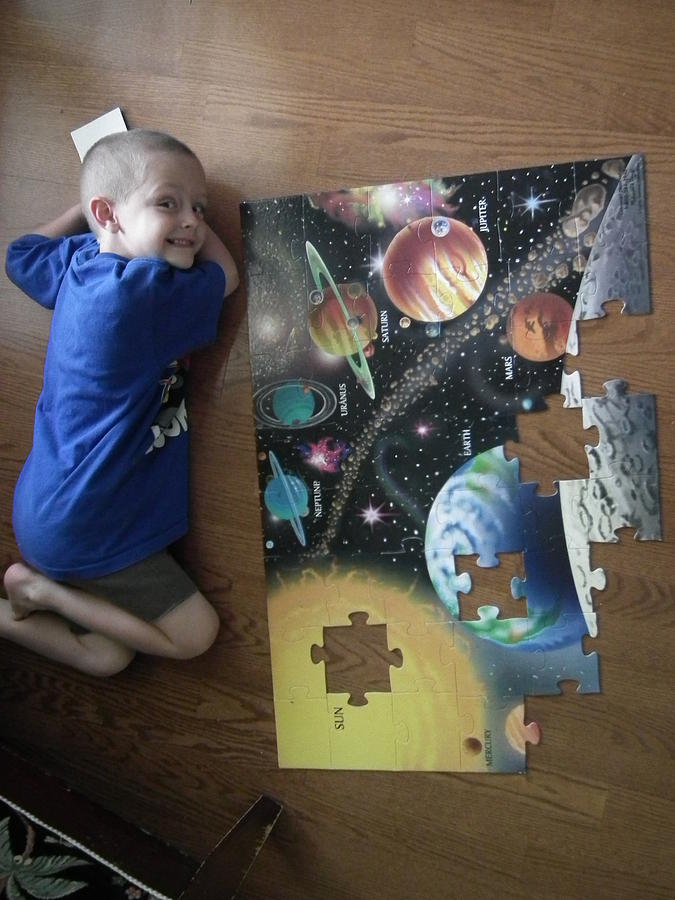 My little Survivor with his Universal Puzzle Photograph by Robert Rhoads