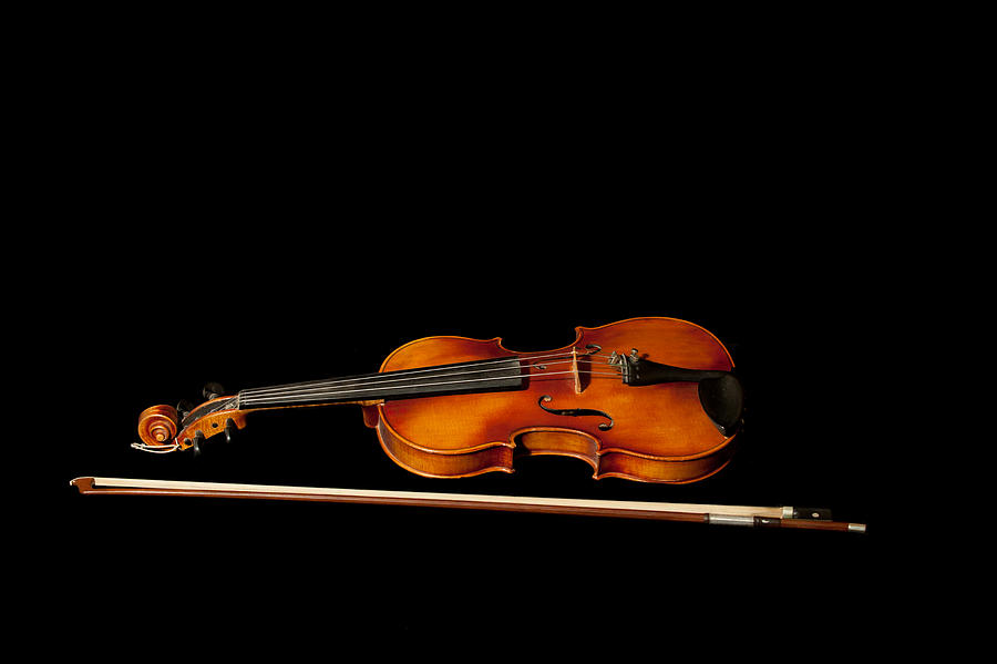 My old fiddle and bow Photograph by Torbjorn Swenelius